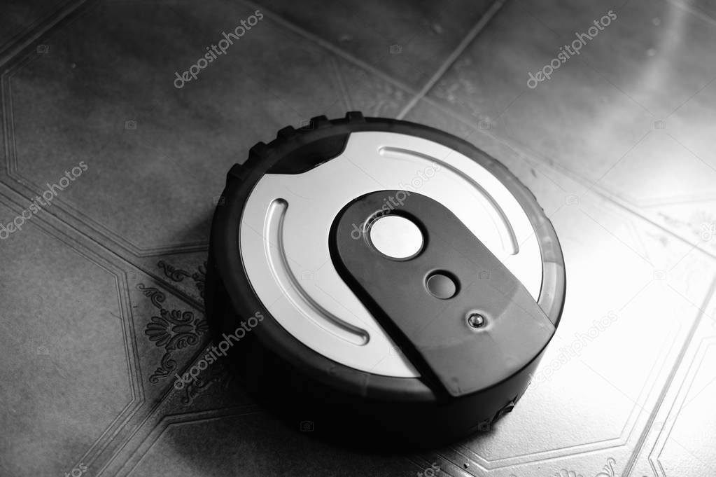 Smart design technology and robotic vacuum cleaner on floor background. Wireless cleaning device and idea