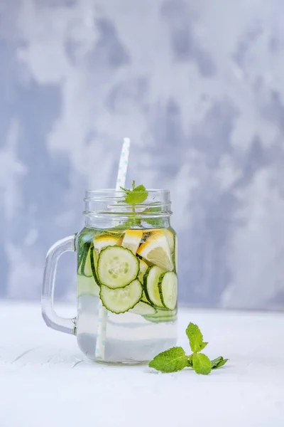 Detox water with cucumber, lemon and mint. The concept of a diet