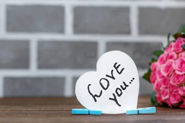 Bouquet of roses and inscription I love you. — Stock Photo, Image