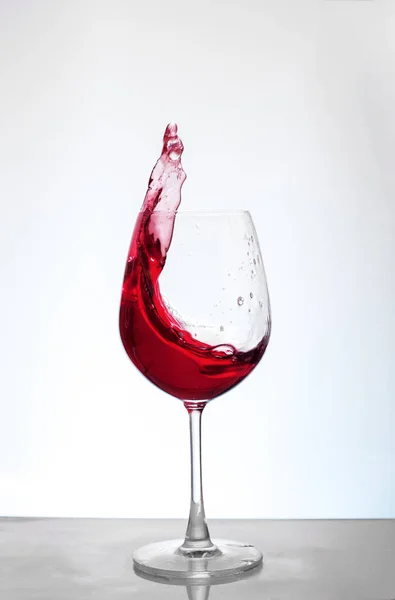 Bordeaux wine on a white background. The concept of alcohol and