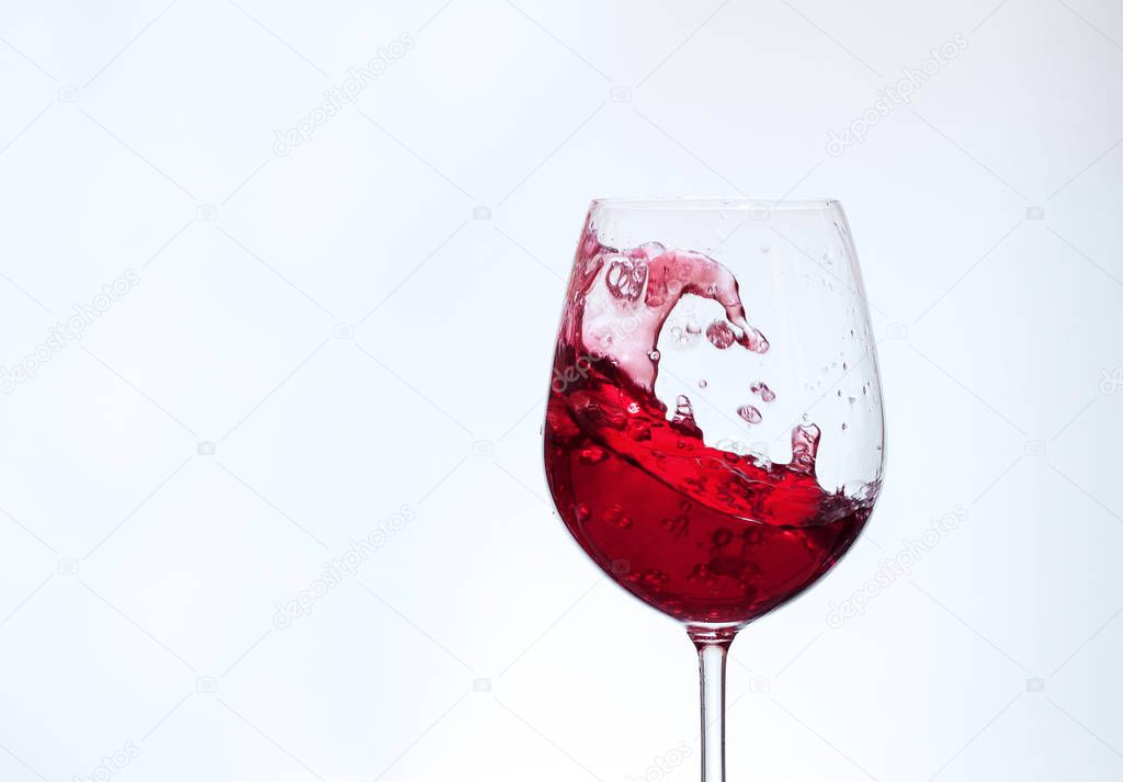 Wine on a white background. The concept of alcohol and party.
