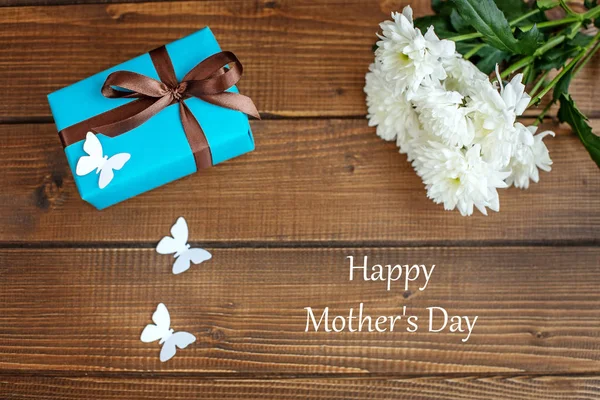 Flowers and gift for mom. The concept of Happy Mother\'s Day.