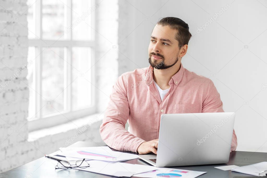 Young adult man working on the implementation of the plan. A man