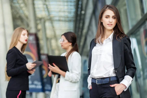 Beautiful smart women in a business suit. Concept for business, boss, work, team and success.