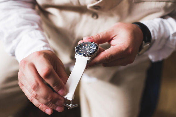 Groom tries on a new watches