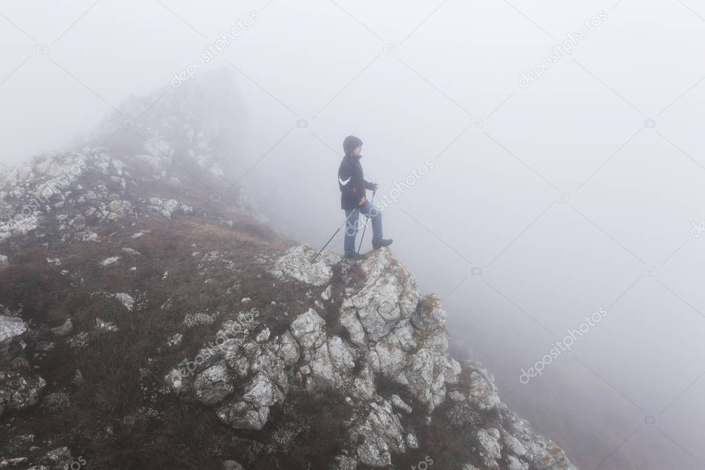 Man climbing to the top of mountan