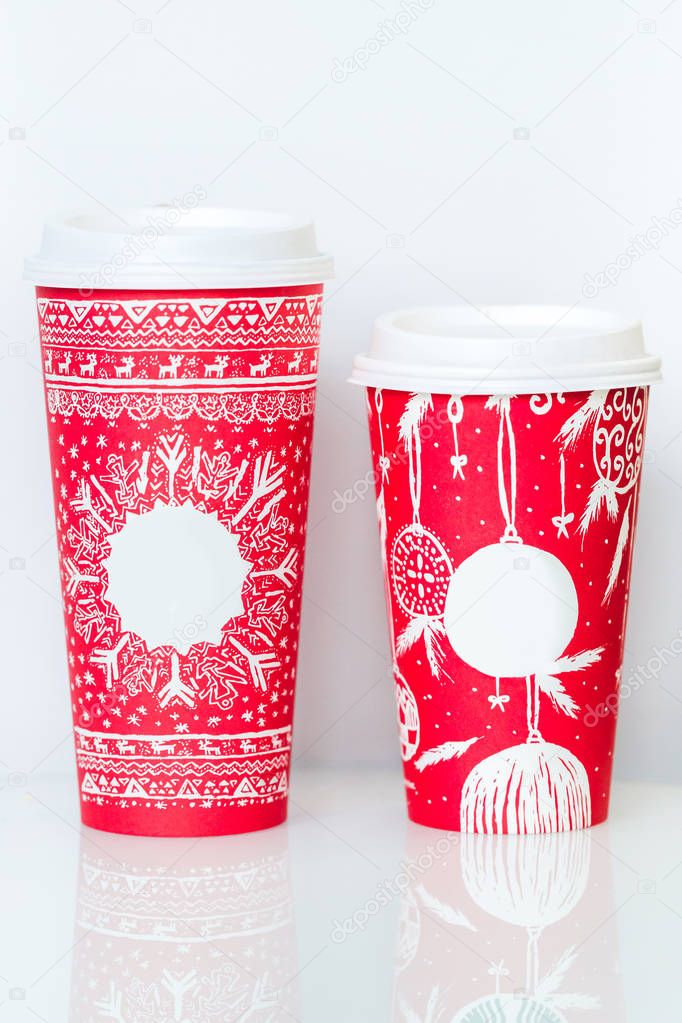 Two different paper coffee cups