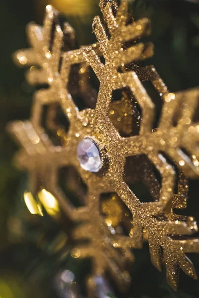 Floco de neve piscando ouro — Fotografia de Stock