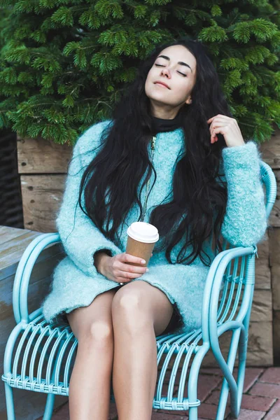 girl enjoying warming drink