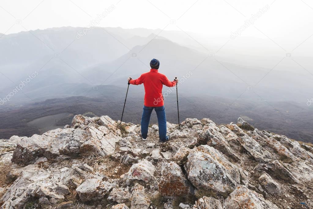 Man standing on top of rock