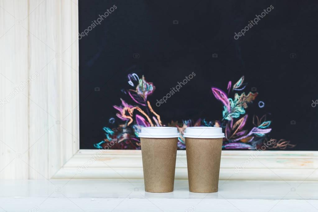 Two carton paper cups 