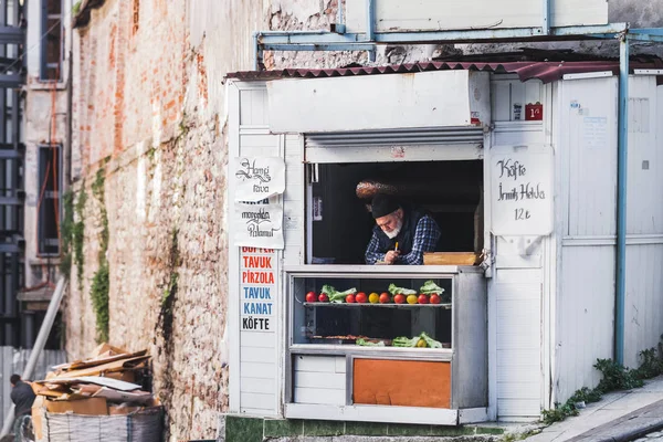 Old man selling sweets in the street — Stock Photo, Image