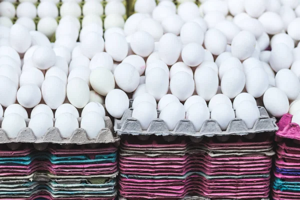 Many white eggs at market — Stock Photo, Image