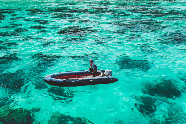 boat floats on clear water