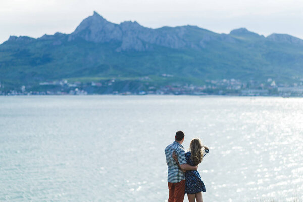 Couple walking outroors by sea