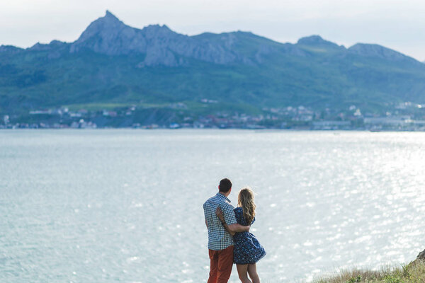 Couple walking outdoors by the sea 