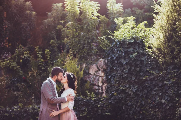 Groom tenderly kissing bride — Stock Photo, Image