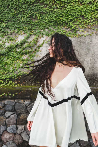 Woman with long curly hair