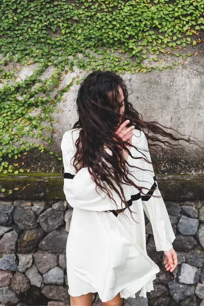 Woman with long curly hair