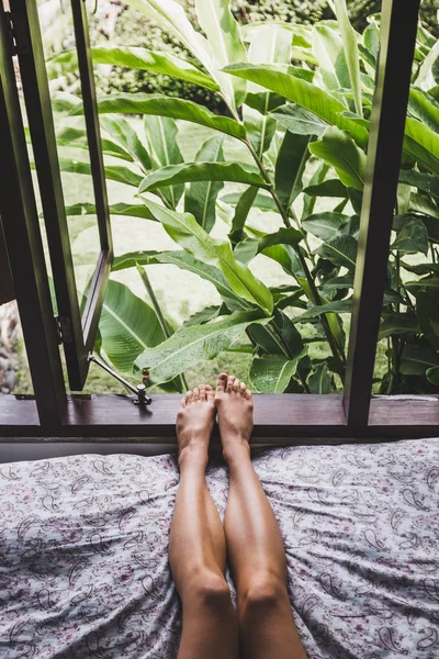 Woman legs in bed in the morning — Stock Photo, Image