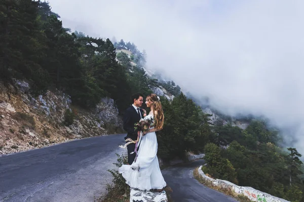 wedding couple walking in mountains