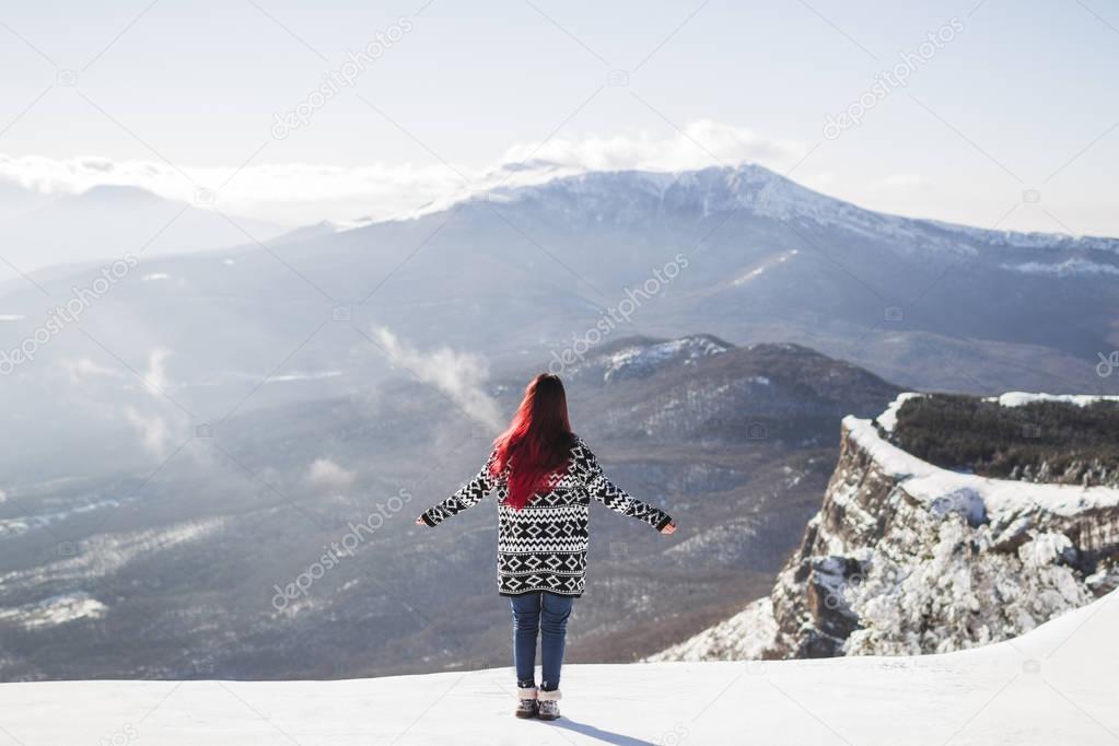 Woman watching mountain panorama