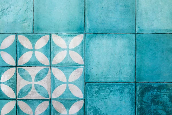 Shabby blue square tile on floor. Turkish or moroccan vintage st
