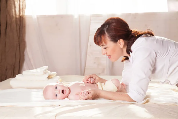 The little boy baby mother doing massage hands and legs — Stock Photo, Image