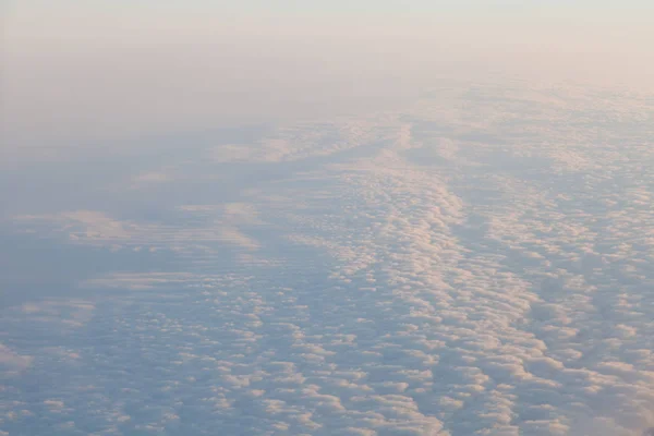 Clouds at sunset from the plane in the sky landscape — Stock Photo, Image