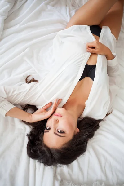 The girl woke up in bed rests in underwear — Stock Photo, Image