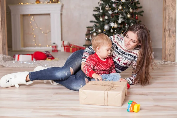 Mother with a small child Christmas Decor Gifts Christmas tree — Stock Photo, Image