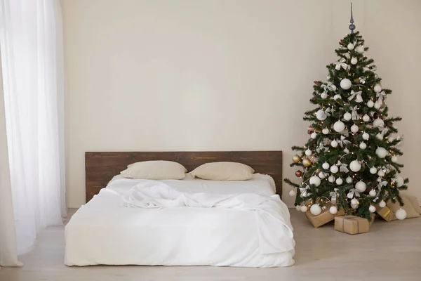 Decor white room with bed new year Christmas gifts — Stock Photo, Image