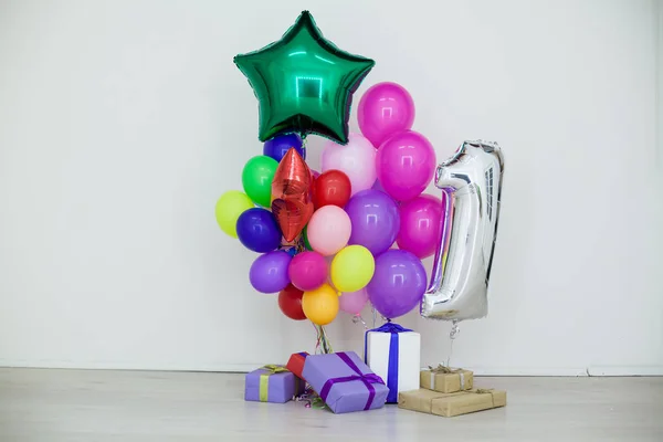 multi-colored balloons and gifts for the holiday