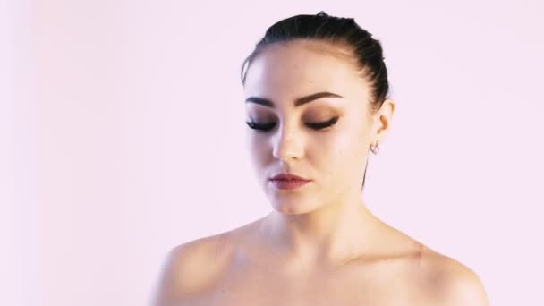 Portrait of a woman brunette on white background — Stock Video