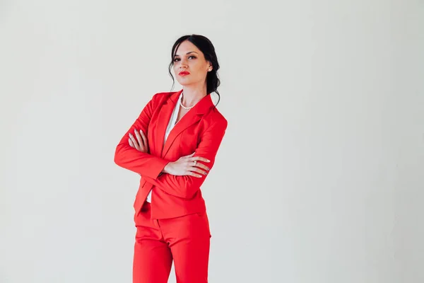 Portrait of a beautiful female student in a red business suit — ストック写真