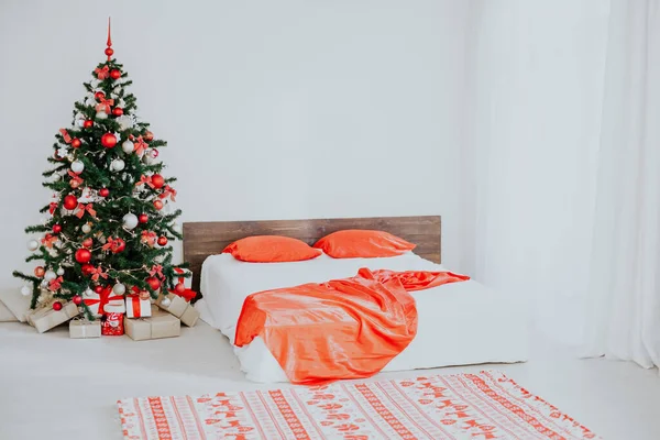 decor white bedroom with Christmas tree Christmas gifts Red