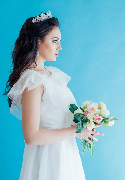 Princess Bride in a white dress with a Crown on a blue background