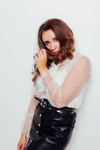 Portrait of a beautiful fashionable woman with locks in business clothes in the office — Stock Photo, Image