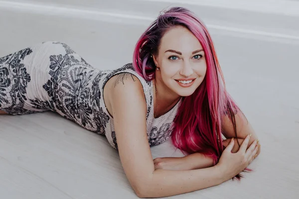 Beautiful girl with pink hair posing at photoshoot — Stock Photo, Image