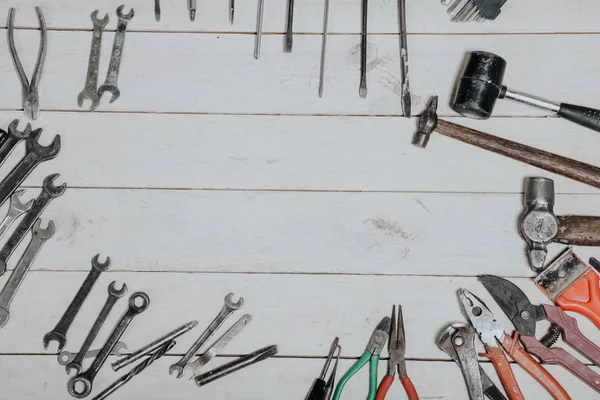 Construction hammers screwdriver repair tool pliers on the board — Stock Photo, Image