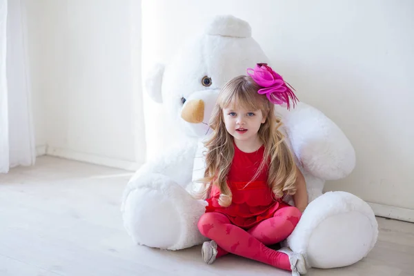 stock image Girl with soft polar bear toy gift