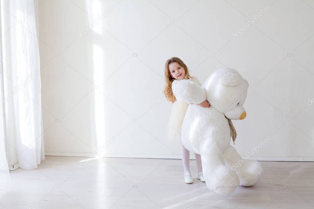 Girl with soft polar bear toy gift