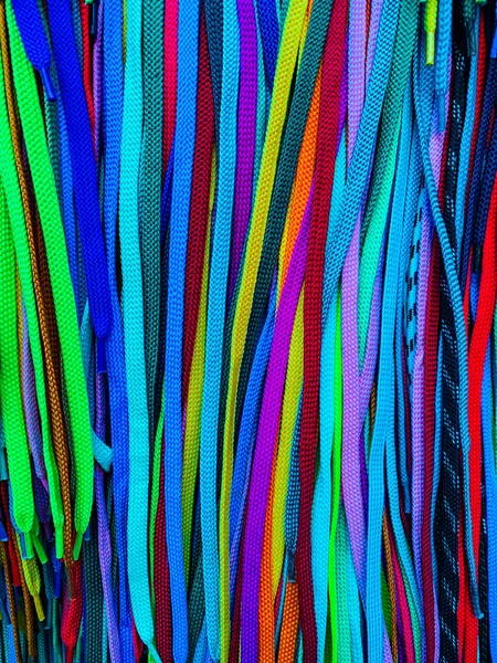 Shoelaces of different colors multicolored ropes as background — ストック写真