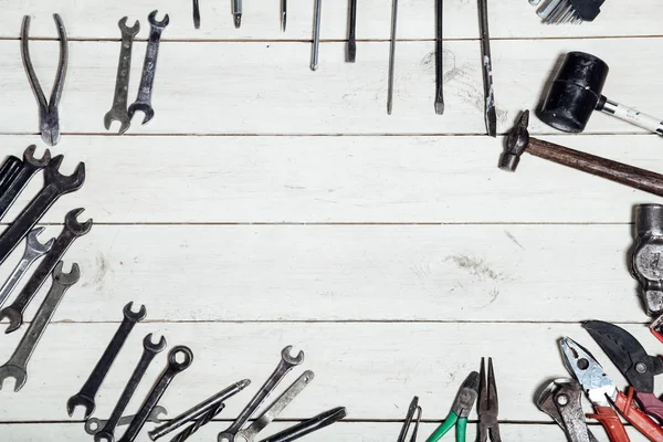 Construction hammers screwdriver repair tool pliers on the board — Stock Photo, Image