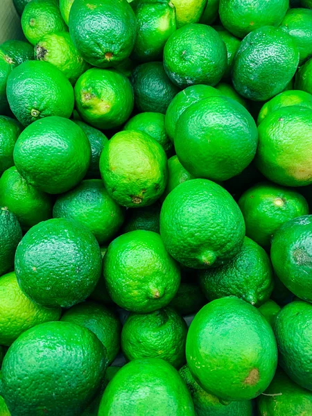 Un montón de lima verde para comer como fondo — Foto de Stock