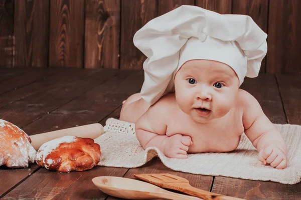 The baby in the head cook flour buns bread — Stock Photo, Image