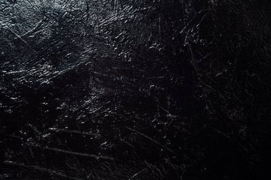 Siyah duvar dokusu bir arkaplan parlatıyor