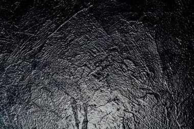 Siyah duvar dokusu bir arkaplan parlatıyor