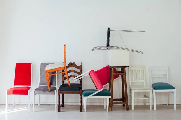 Many Multicolored Chairs Stand Wall Interior White Room — 스톡 사진