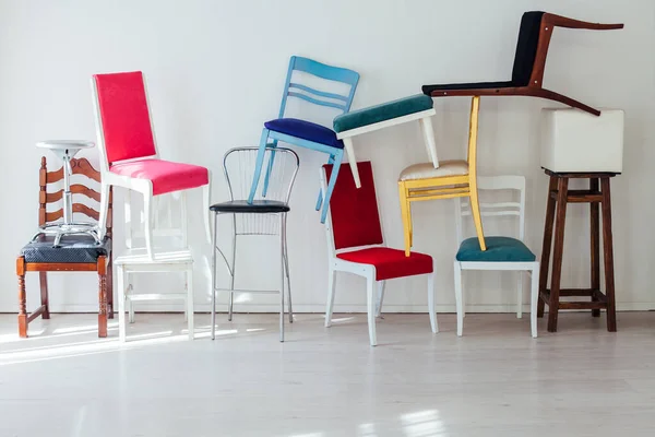 Many Multicolored Chairs Stand Wall Interior White Room — Stock Photo, Image